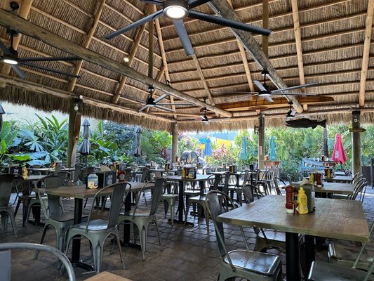 Photo of Golden Rule Seafood - Maimi, FL, US. Covered dinning by the bar (new tiki hut)