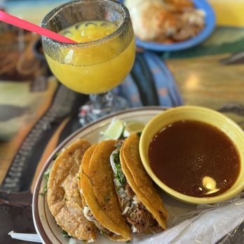 La Parada - a plate of tacos and a glass of orange juice - Mexican Near Me - Indianapolis, Indiana
