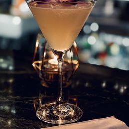 a cocktail in a martini glass a cocktail in a martini glass