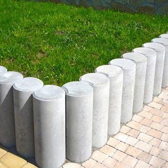Martinez Landscaping - a row of concrete posts with grass growing between them - Tree Services Near Me Martinez Landscaping - a row of concrete posts with grass growing between them - Tree Services Near Me