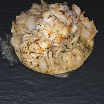 PepeNero Ristorantino Mediterraneo - The curry seafood pasta. Loaded with seafood and lobster. I was a bit skeptical of the curry,  but SO good - Italian Near Me - Traverse City, Michigan