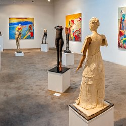 Figurative sculpture adjacent large abstract paintings are shown here in our salon gallery.