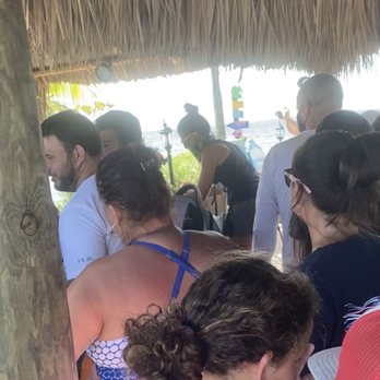 Key Largo Parasail - Crowded area between my table and the registration are. No one wearing masks. - Parasailing Near Me - Key Largo, Florida