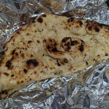 Halal Kabab & Wings - Garlic Naan, chewy texture with garlic pieces but not very buttery/salty. - Indian Near Me - Arbutus, Maryland Halal Kabab & Wings - Garlic Naan, chewy texture with garlic pieces but not very buttery/salty. - Indian Near Me - Arbutus, Maryland