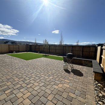Legends Landscaping - Perfectly matched and extended the pavers to create a larger patio, framed and added artificial grass and planted desert friendly landscape. - Landscaping Near Me - Sparks, Nevada Legends Landscaping - Perfectly matched and extended the pavers to create a larger patio, framed and added artificial grass and planted desert friendly landscape. - Landscaping Near Me - Sparks, Nevada