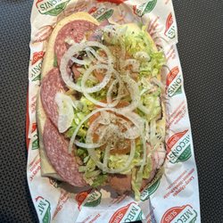 Meconi's Italian Subs - Half a sandwich (so big!)- turkey, salami, pastrami with all of the fixings!