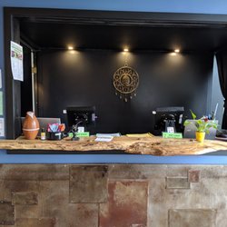 Project 7 Yoga - Front desk to the right of the front door.