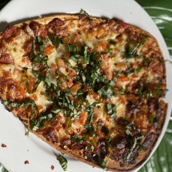 La Diosa Cellars - Margherita: fresh and aged mozzarella, sundried tomato tapenade, garden cut Basil, extra virgin olive oil, and red pepper flakes - Spanish Near Me - Lubbock, Texas