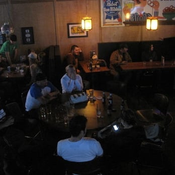 Main Street Bar - a group of people sitting around a table - Pubs Near Me - Battle Ground, Washington Main Street Bar - a group of people sitting around a table - Pubs Near Me - Battle Ground, Washington