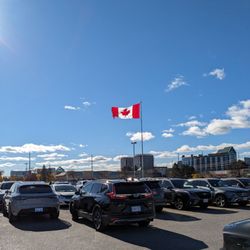 Markham Town Square - Sunny day as I watch this person take two minutes to back out of her spot and leave.