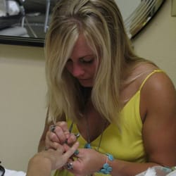 Beauty Center Wellness Salon & Spa - Stephanie focused on beautifying nails.