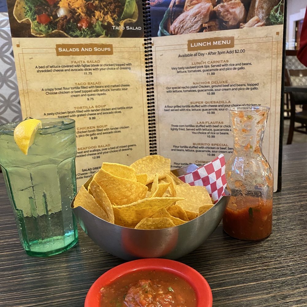 Chips and salsa with cilantro.