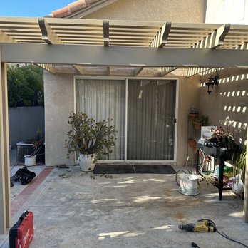 Bravo Patio Covers - Lattice patio cover with power outlet on the outside pole. - Patio Coverings Near Me Bravo Patio Covers - Lattice patio cover with power outlet on the outside pole. - Patio Coverings Near Me
