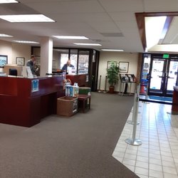 State Employees Credit Union - Workers gossiping instead of helping customers seated in waiting area.