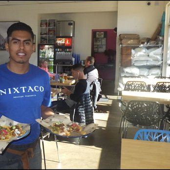 Nixtaco - Our friendly server, Mario, delivers our "Taco Samplers" with a smile. - Mexican Near Me - Roseville, California