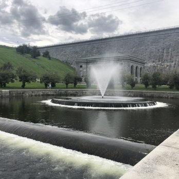 Wachusett Reservoir Dam - A walking path surrounds this fountain, water basin, water works building and the dam in the background. - Hiking Near Me - Clinton, Massachusetts