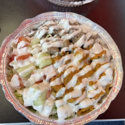 Flame Halal Gyro - Lamb & Chicken Combo on Rice with the yogurt sauce on top!