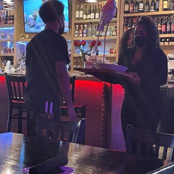 Deluxe Fun Dining - Flaming Statue - Bars Near Me - Charlotte, North Carolina