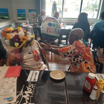 Mo's Seafood - Bday girl with the flowers - Seafood Near Me - Towson, Maryland Mo's Seafood - Bday girl with the flowers - Seafood Near Me - Towson, Maryland