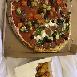 Brezzi's Wood Fired Pizza - Pizza and potato wedges.