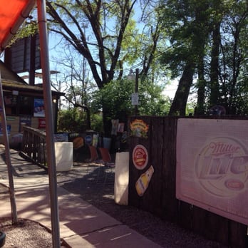 Back Door Tavern - outside seating area with tables and umbrellas - Dive Bars Near Me - Knoxville, Tennessee