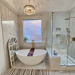 TruBlue of Allen - Allen TX. Full Master Bathroom remodeling. New flating vanities, undelighting. Flooring, painting. New Shower with bench, Freestanding tub.