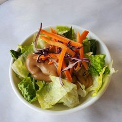 Saladang - Mixed Salad with peanut sauce dressing. Crisp and refreshing. The first part of the entrée served.