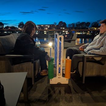 City Cruises - Son and wife enjoying a game of Connect Four on the top deck - Venues & Event Spaces Near Me - Marina del Rey, California