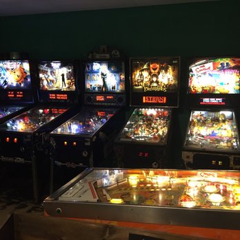 Far Out Coffee Post - a row of pinball machines - Coffee & Tea Near Me - Vancouver, British Columbia Far Out Coffee Post - a row of pinball machines - Coffee & Tea Near Me - Vancouver, British Columbia