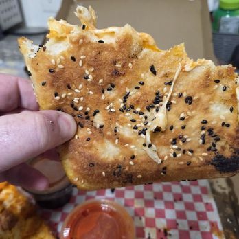 Lucci’s Pizza - Look at those seeds backed in. Don't knock it.   Adds so much to it. - Pizza Near Me - Clifton, New Jersey
