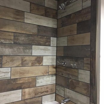 Projects by Aaron Pont - a bathroom with a wooden wall - Flooring Near Me - Port Angeles, Washington Projects by Aaron Pont - a bathroom with a wooden wall - Flooring Near Me - Port Angeles, Washington
