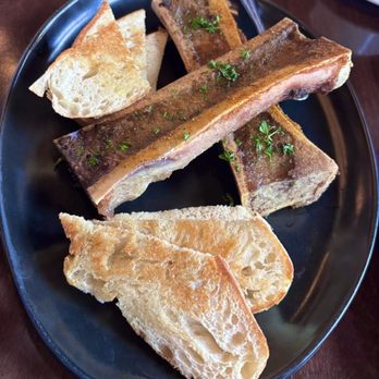 Cynara Restaurant & Lounge - Roasted bone marrow: served with grilled bread. Absolutely delicious. - New American Near Me - Olympia, Washington Cynara Restaurant & Lounge - Roasted bone marrow: served with grilled bread. Absolutely delicious. - New American Near Me - Olympia, Washington