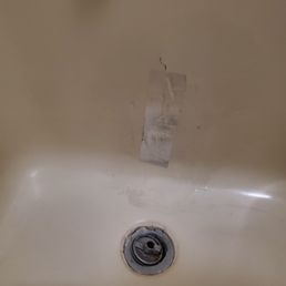 Duct tape over hole in tub.