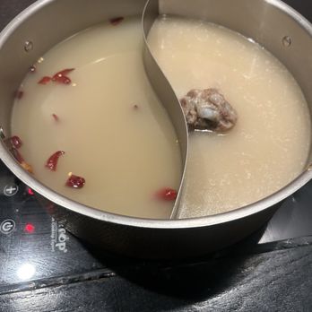 Top Pot - Mongolian broth (left) Japanese pork bone broth (right) - Hot Pot Near Me - Braintree, Massachusetts