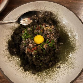 Paju - This squid ink rice dish has amazing flavor! You can taste the fire too! It's a must! - Korean Near Me - Seattle, Washington Paju - This squid ink rice dish has amazing flavor! You can taste the fire too! It's a must! - Korean Near Me - Seattle, Washington