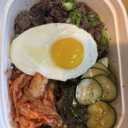 Korean Bulgogi Beef with kimchi, cucumbers, and seaweed. Plus an egg.
