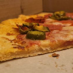 Angelo's Italian Deli - As you can see from the photo, the pizza dough has no rise. Looks like it was run over.