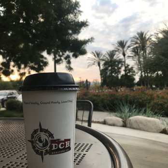 DCH Roasters - Riverside - a coffee cup on a table - Coffee & Tea Near Me - Riverside, California