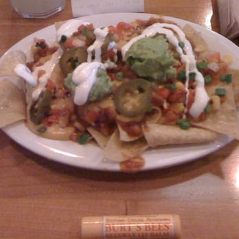 Veggie Grill by Next Level - Uptown nachos ($4.95... Burts bees is in the pic for portion size comparison) - Sandwiches Near Me - El Segundo, California
