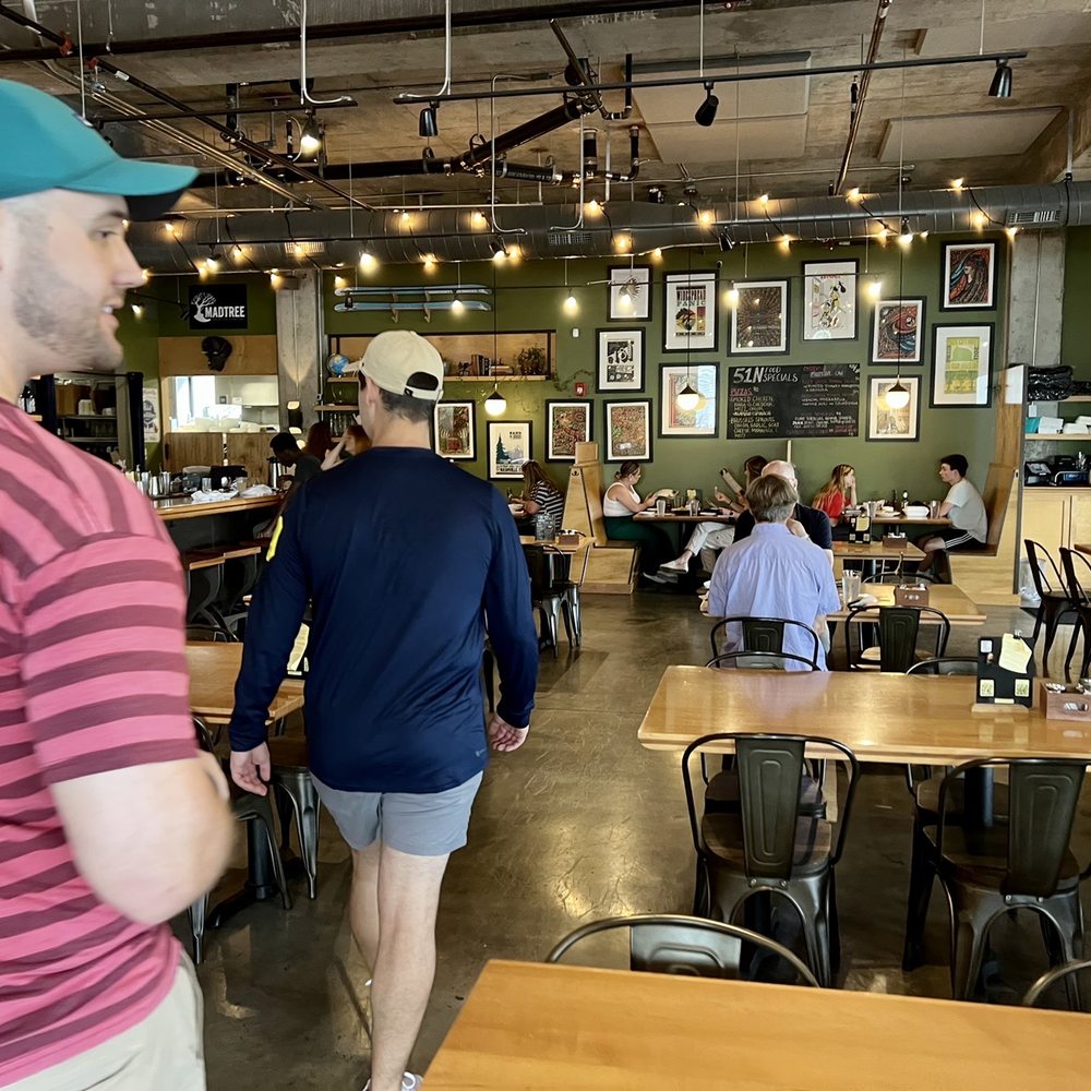 a man in a blue hat and a man in a pink shirt a man in a blue hat and a man in a pink shirt