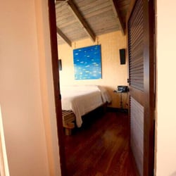 Vieques Vacation Rental - Master bedroom penthouse natural floors, terrace, en suite bathroom and the most picturesque ocean and park views of the whole island.