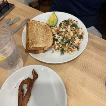 Eggsquisite Cafe - ironman egg white scramble and what was left of our side of crispy bacon - Breakfast & Brunch Near Me - Fort Worth, Texas