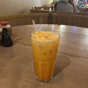 Thai Fusion - a glass of iced coffee on a table - Thai Near Me - Barboursville, West Virginia Thai Fusion - a glass of iced coffee on a table - Thai Near Me - Barboursville, West Virginia