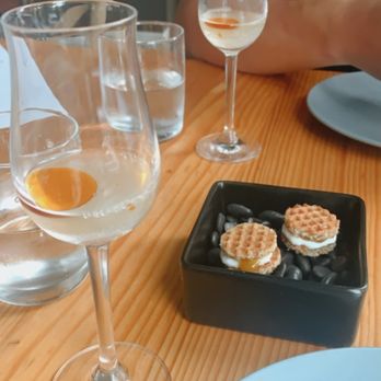 Emmer & Rye - mini waffle with bay cream/tomato jam. Accompanied with a cantaloupe amazake with chile as a palate cleanser - Tapas/Small Plates Near Me - Austin, Texas
