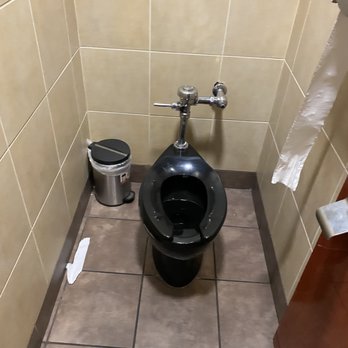 McDonald's - a toilet and trash can in a public restroom - Fast Food Near Me - Albuquerque, New Mexico