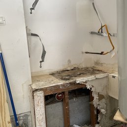 After properly removing the installed water heater, our next move is to replace the damaged drywall AND particle board. After properly removing the installed water heater, our next move is to replace the damaged drywall AND particle board.