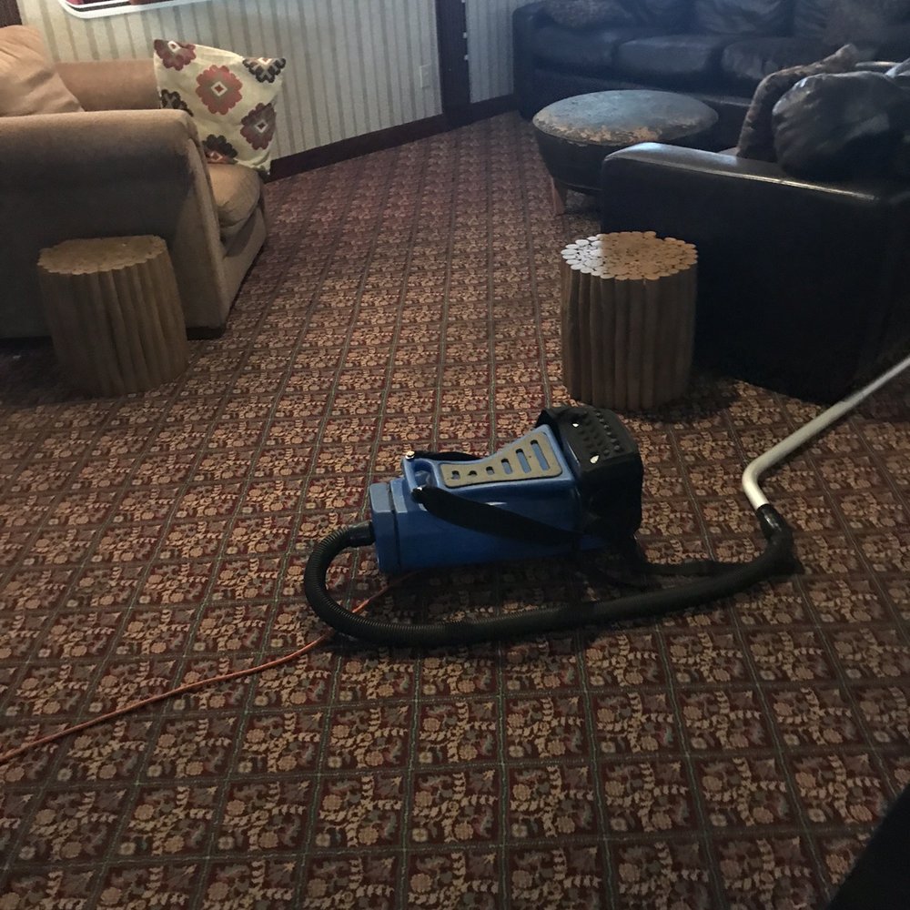 Vacuum cleaner in restaurant. Vacuum cleaner in restaurant.