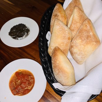 Aprile Restaurant - Complimentary bread with olive and tomato spreads - Italian Near Me - Doral, Florida Aprile Restaurant - Complimentary bread with olive and tomato spreads - Italian Near Me - Doral, Florida