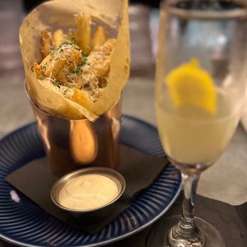 Celeste - Truffle fries with a French 75 - Cocktail Bars Near Me - Chicago, Illinois Celeste - Truffle fries with a French 75 - Cocktail Bars Near Me - Chicago, Illinois
