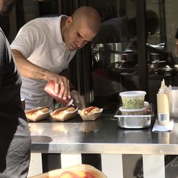 Manny the hot dog specialist hard at work